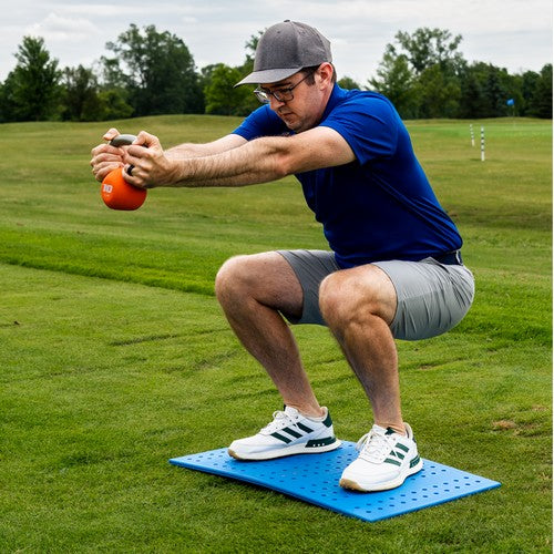 Man demonstrating a squat stance on the force board pro