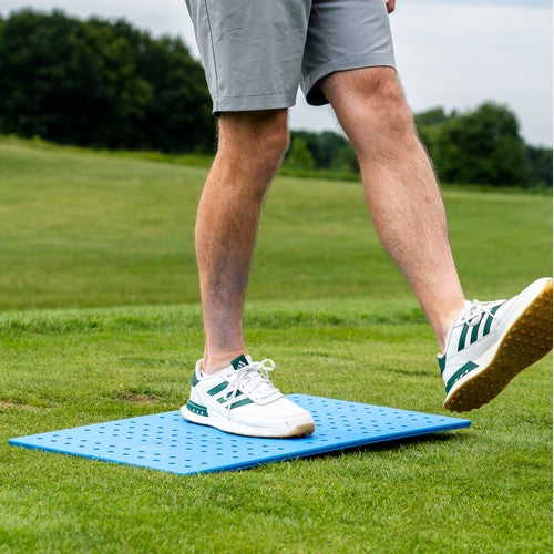 Man standing on one foot on the force board pro