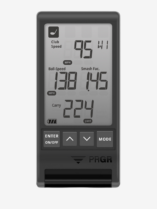 A digital display of the PRGR Black Portable Launch Monitor showing swing speed, ball speed, and carry distance.