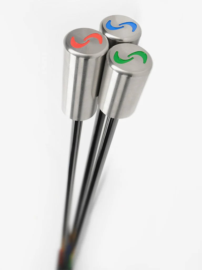 Three golf training clubs with color-coded heads: red, blue, and green, against a white background.