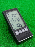 The PRGR Portable launch monitor on the green showcasing its digital screen