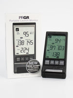 The PRGR Portable launch monitor on the white background side by side with its packaging