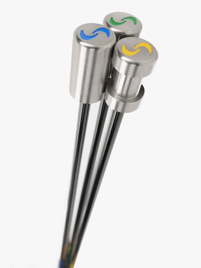 A set of three SuperSpeed golf training clubs, each with a different color grip: yellow, green, and blue, aligned vertically.